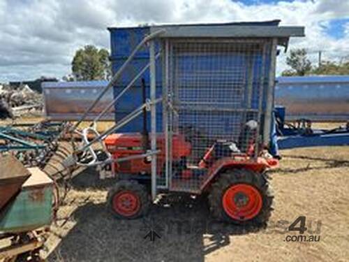 caption Kubota Three-Point-Linkage 4WD PTO Tractor With Cane Interrow Sprayer
