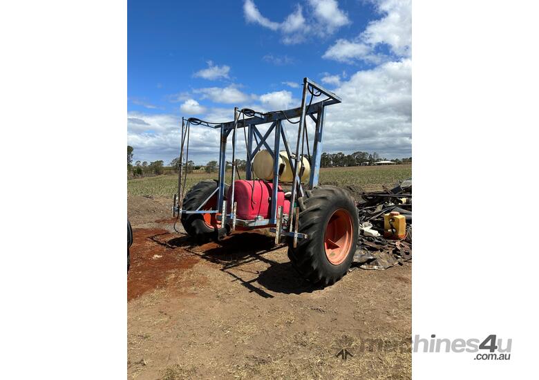 caption Kubota Three-Point-Linkage 4WD PTO Tractor With Cane Interrow Sprayer