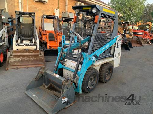 caption Toyota 4SDK4 Skid Steer – Compact Loader for Excavation & Handling!