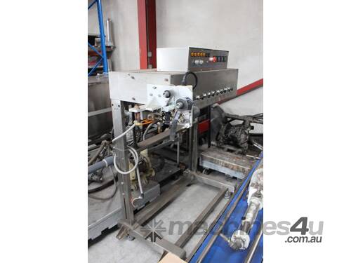 caption Continuous Band Sealer with Stainless Steel Conveyor.