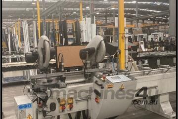 Double head sawing machine with down-feed blades