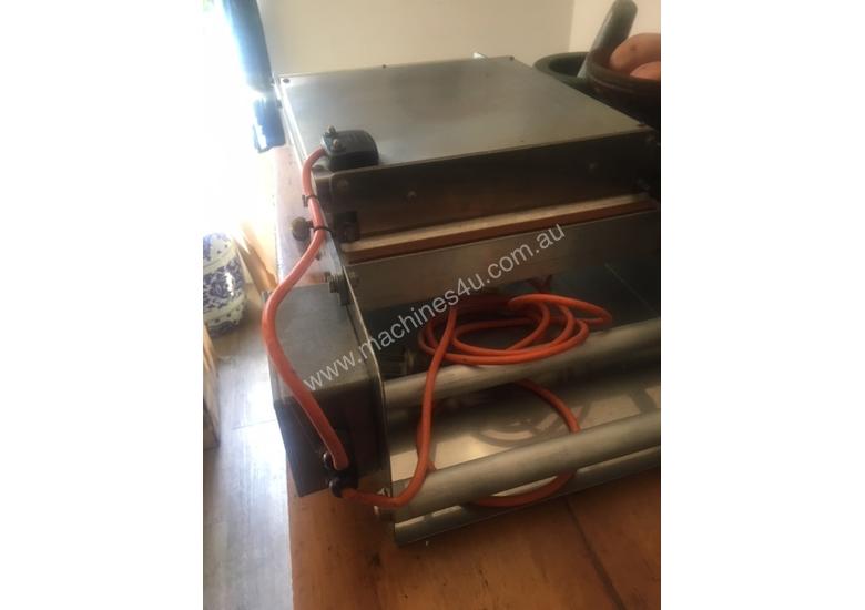 caption HELIX Tray Sealer