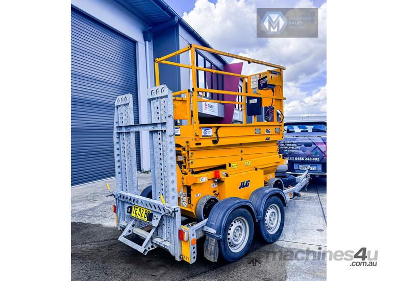 caption JLG 19ft Scissor Lift and Trailer