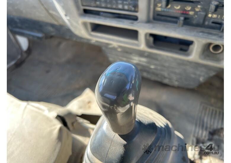 caption 1994 Isuzu NPR 200 Table Top