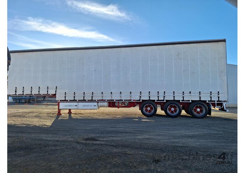 caption 2013 Maxitrans ST3-NSTCH Tri Axle Drop Deck Curtainside Trailer