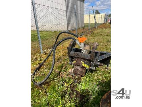 Posthole digger attachment suited for a Dingo